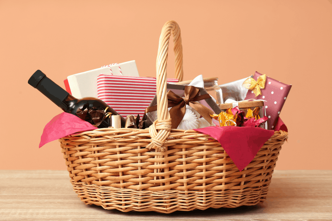 Easter gift basket with snacks, wrapped presents, and drinks as a non-chocolate Easter gift idea