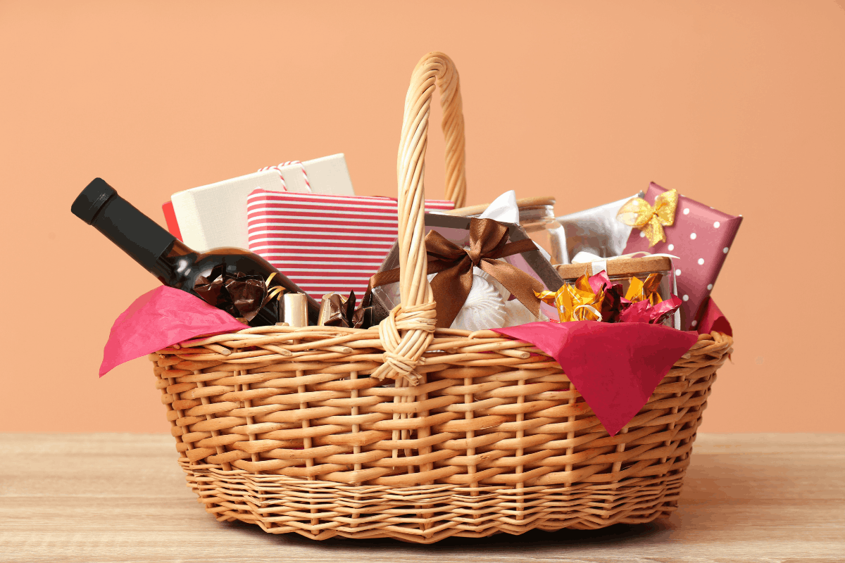 Easter gift basket with snacks, wrapped presents, and drinks as a non-chocolate Easter gift idea